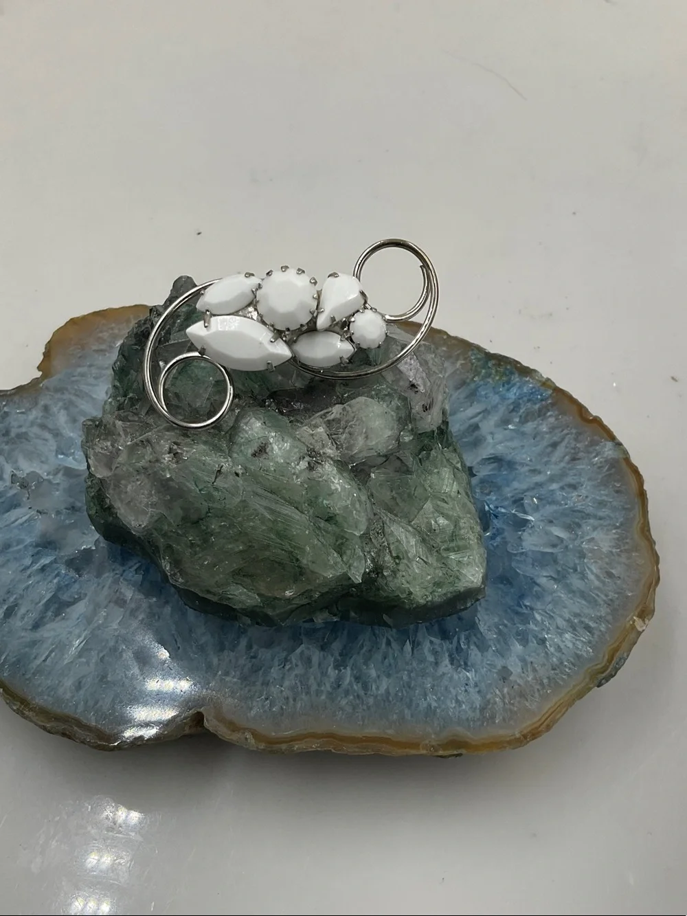 Vtg. White Milk Stone Silver Swirl Floral Brooch (2”Lx1”W)